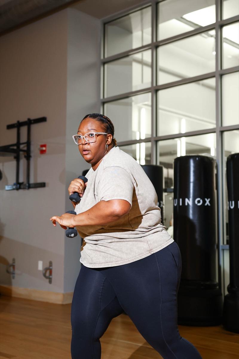 A member throwing a punch during a boxing class