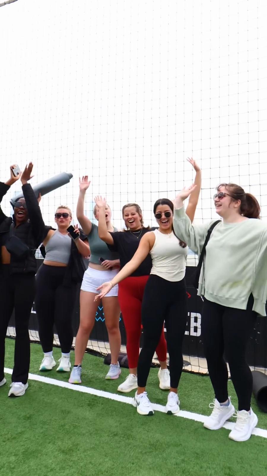 Members high-fiving each other during a studio class